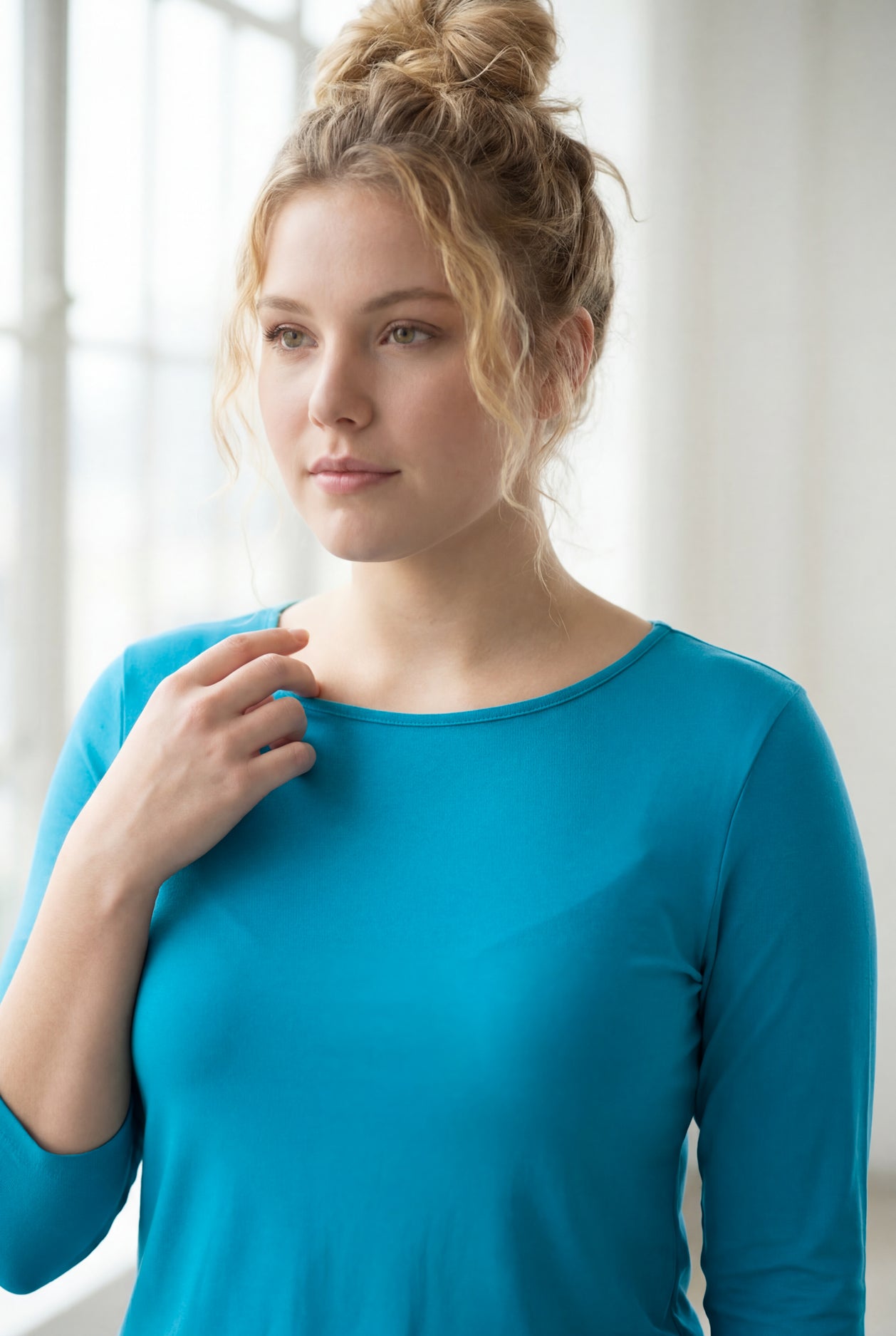 Model wearing the Nuggles® Essential 3/4 Tee in Teal