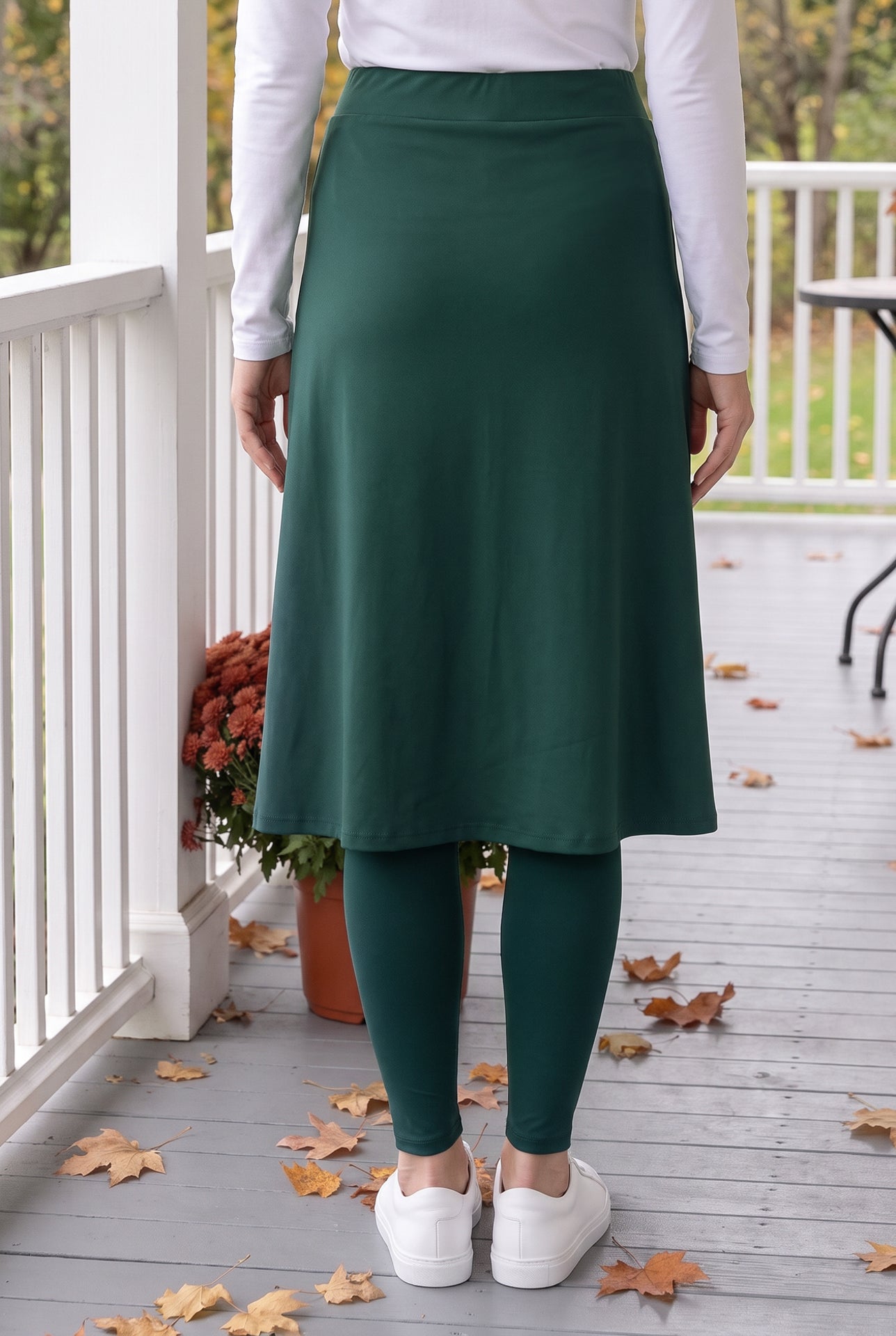Model wearing Nuggles® Tilly Sport Skirt in Teal Green