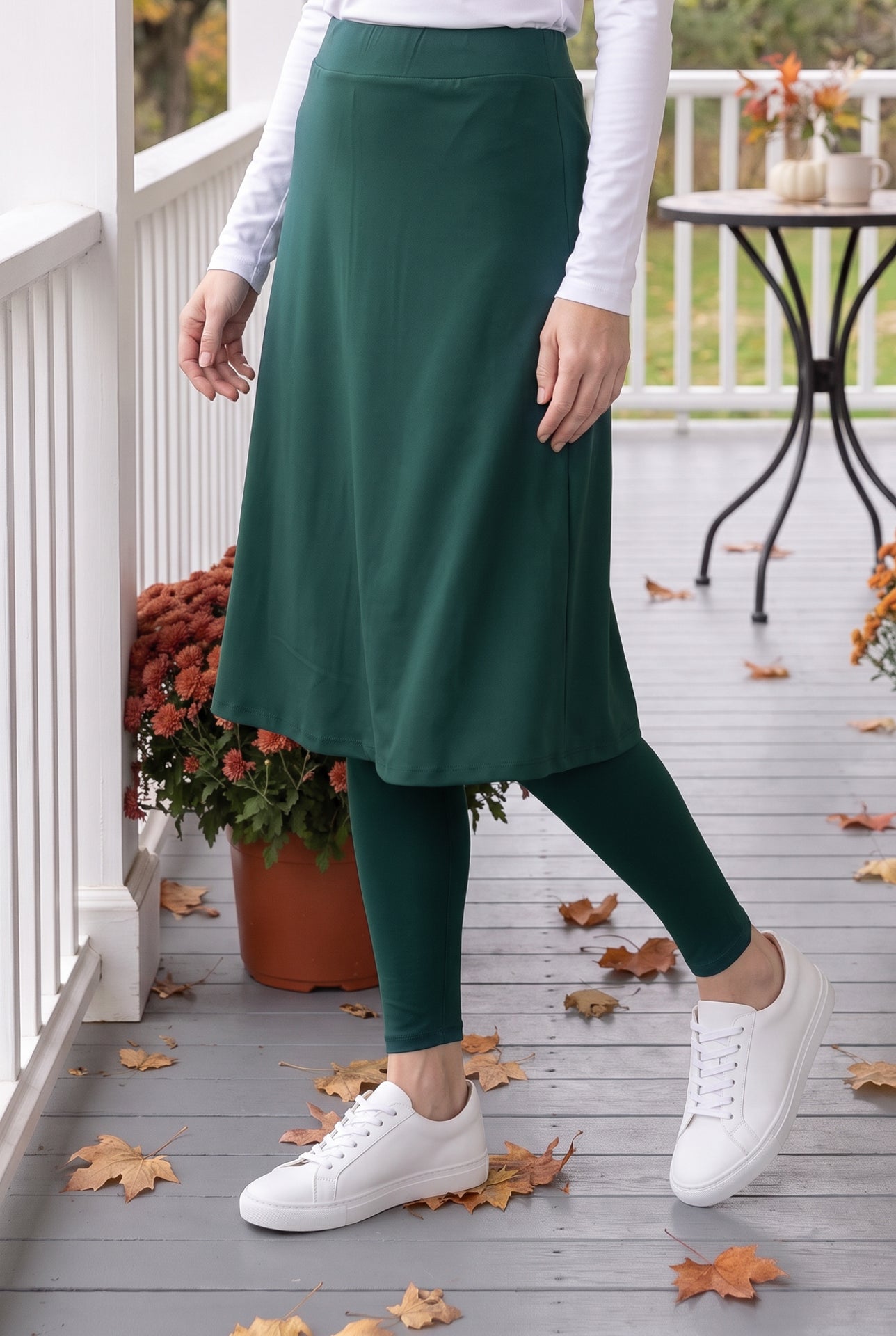 Model wearing Nuggles® Tilly Sport Skirt in Teal Green