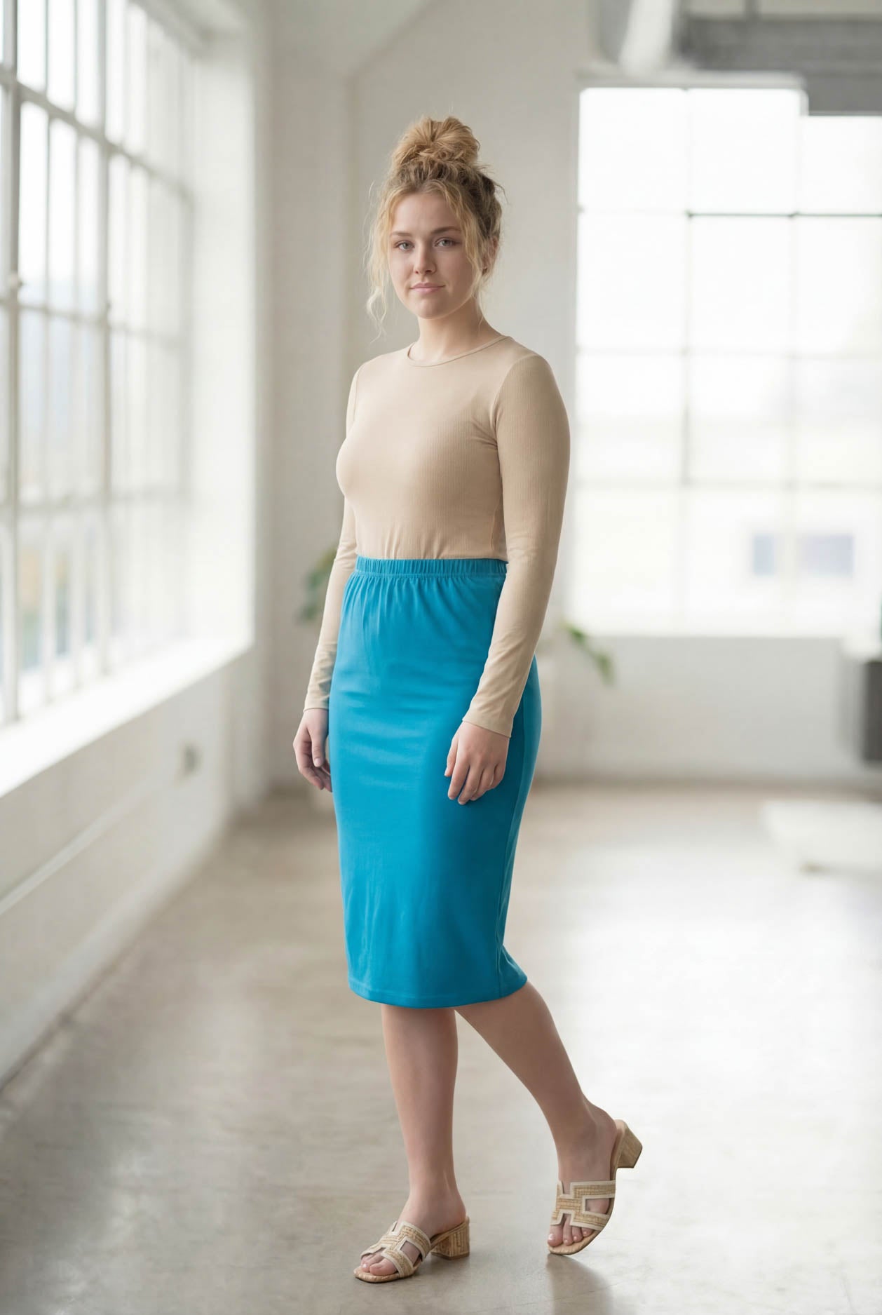 Model wearing Nuggles® 27" Classic Skirt  in Turquoise