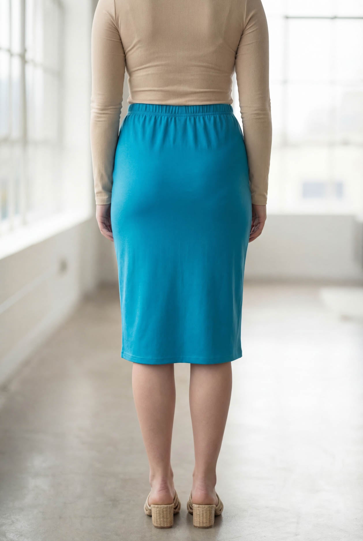 Model wearing Nuggles® 27" Classic Skirt  in Turquoise