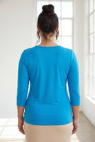 Model wearing Nuggles® 3/4 Essential Tee in Turquoise