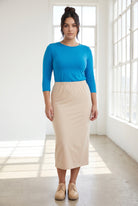 Model wearing Nuggles® 3/4 Essential Tee in Turquoise
