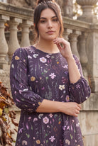 Nuggles® Patricia Dress in Twilight Garden, upper-body portrait, wildflower print on deep plum