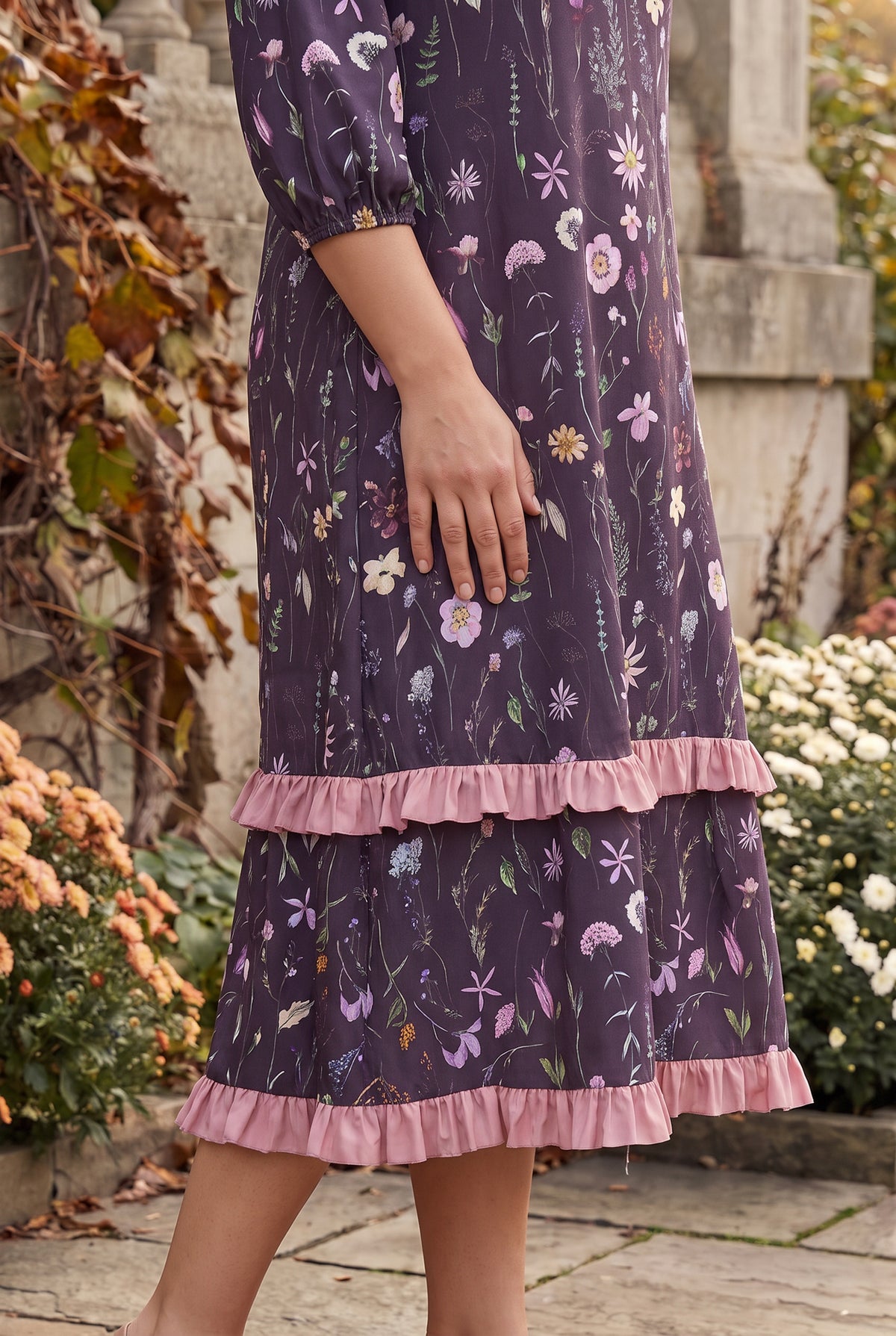 Nuggles® Patricia Dress in Twilight Garden, side crop of the tiered skirt and its two pink ruffles