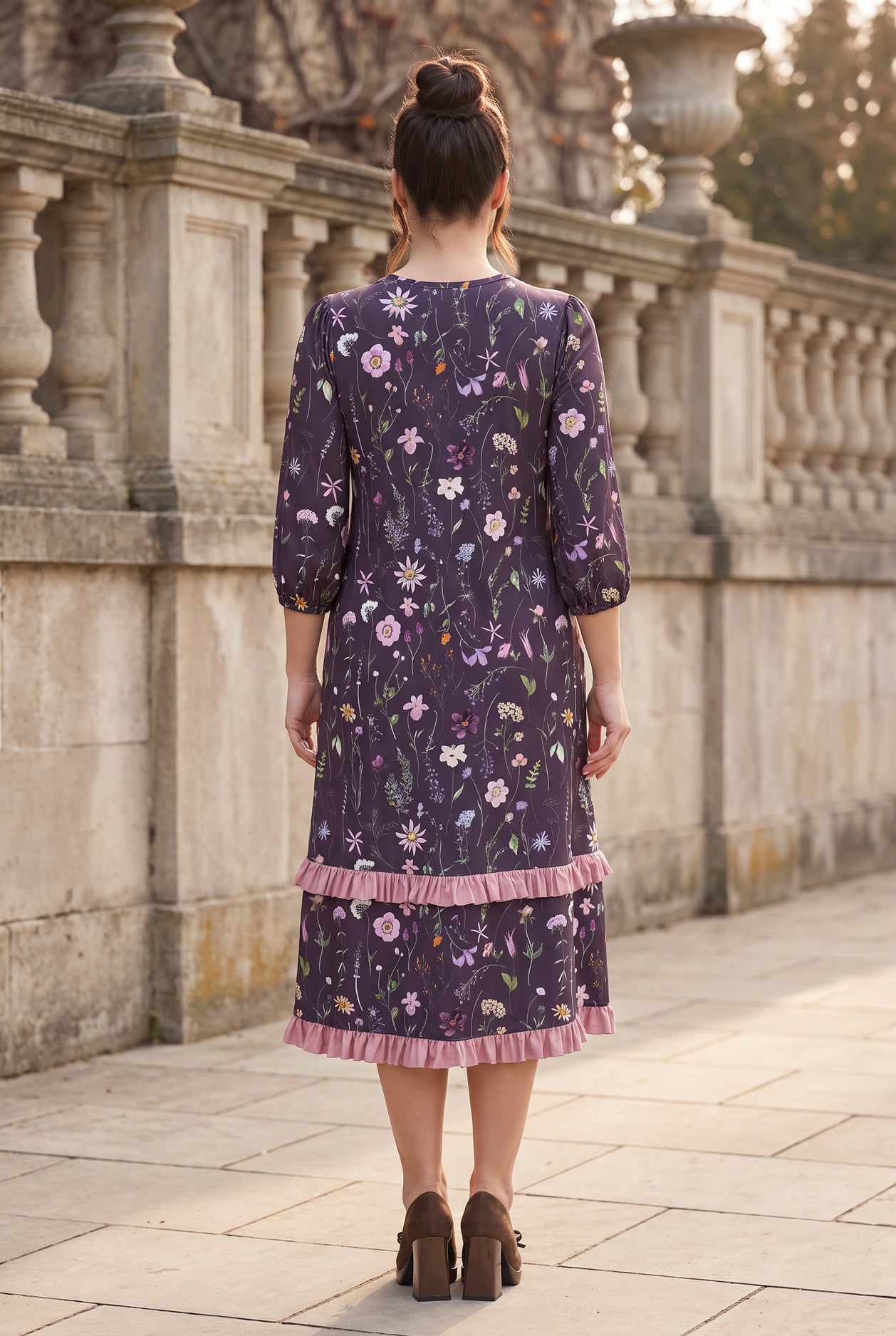 Nuggles® Patricia Dress in Twilight Garden, full-length back view showing the relaxed fit and ruffle tiers