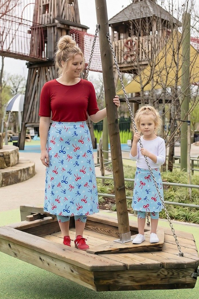 Model wearing Nuggles® Girls All-Sport Skirt in Bow Active