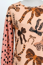 Model wearing the Nuggles® Bryauna Top in Love & Leopard