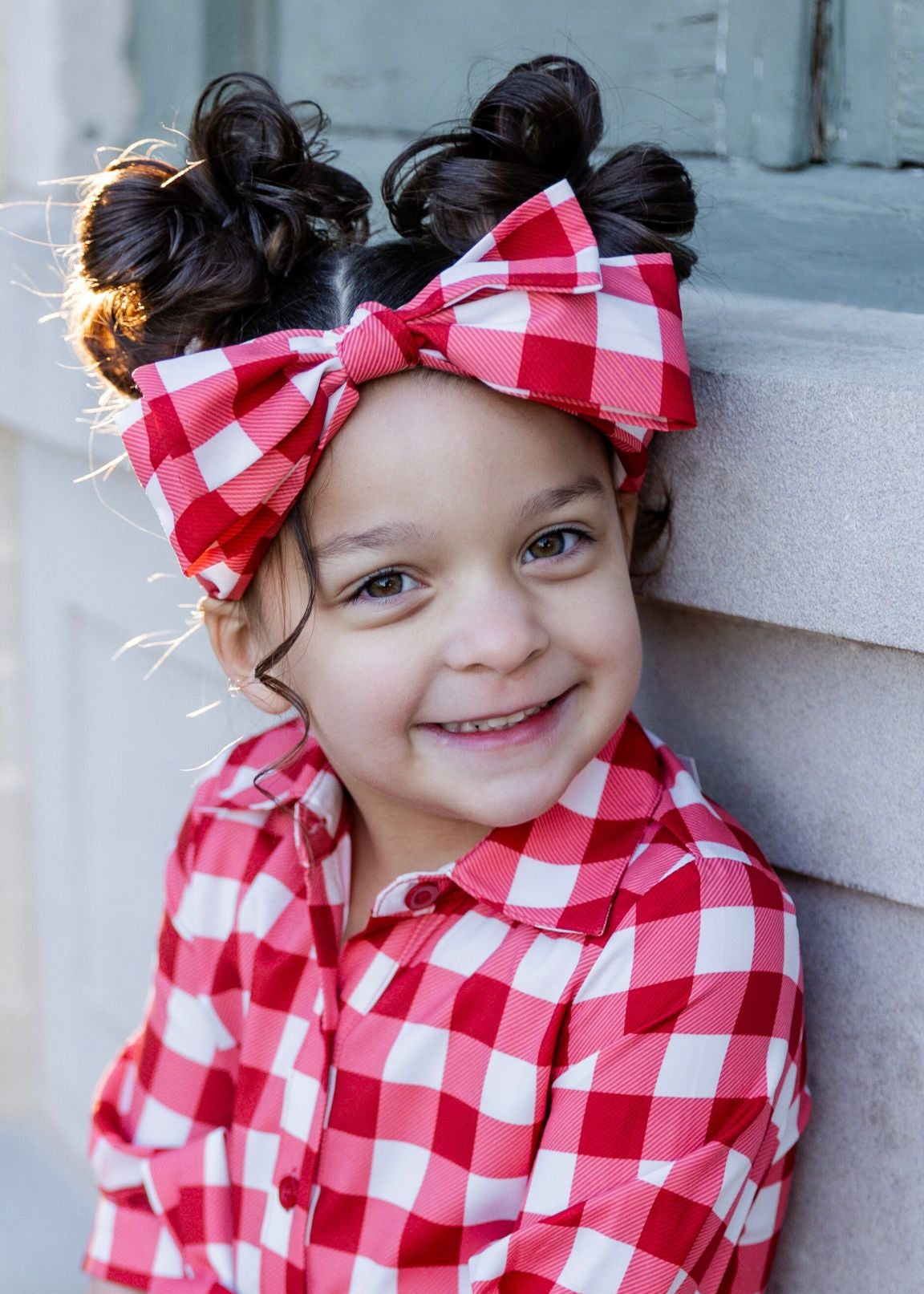 Model wearing the Nuggles® Headband in Cherry Jam