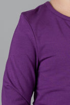 Model wearing the Girls' Nuggles® Essential 3/4 Tee in Violet