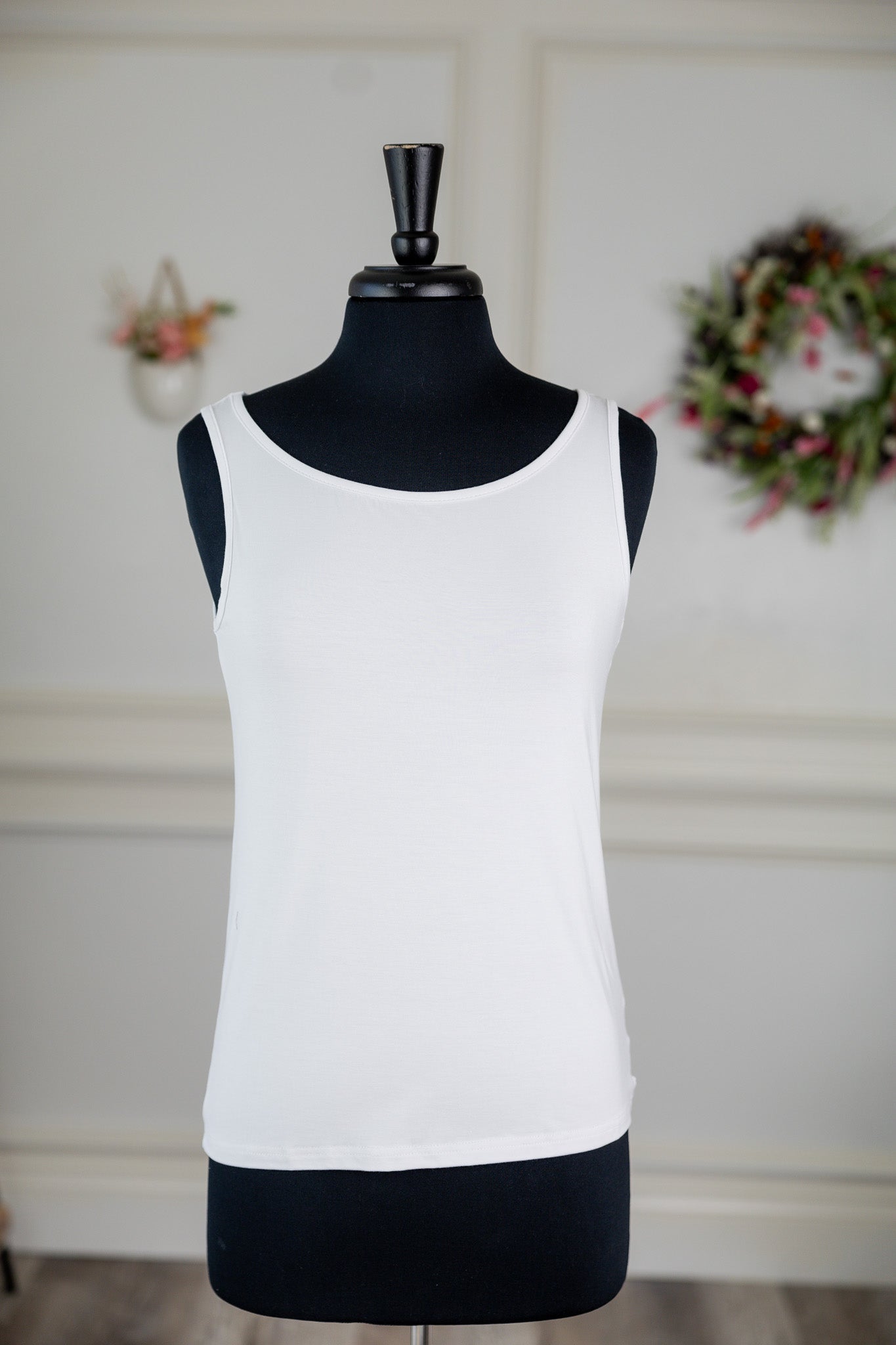 Stock photo of the front of our Nuggles® Essential Wide Neck Tank in White