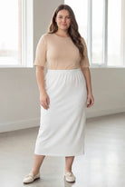 Model wearing Nuggles® 34" Classic Skirt  in White
