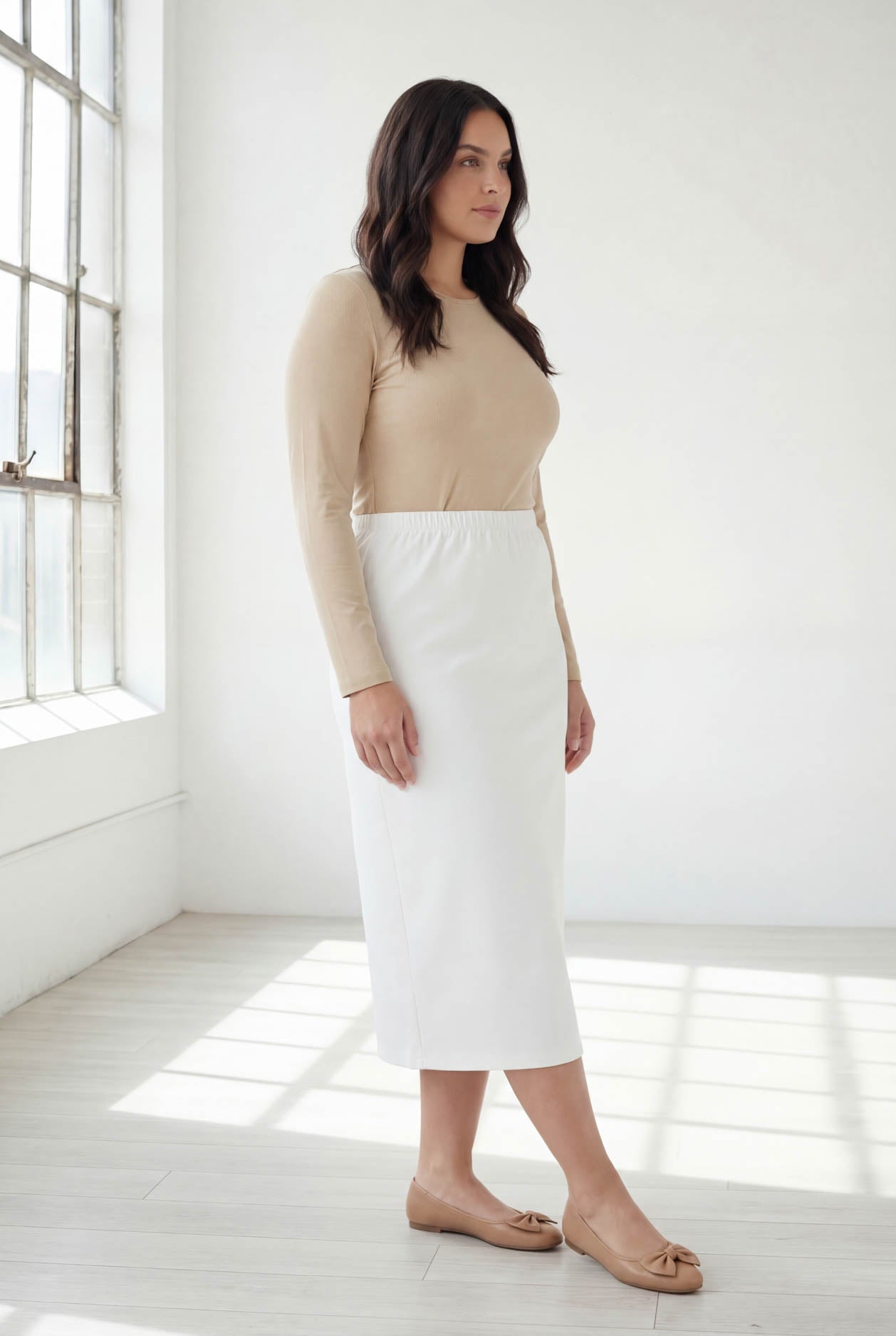 Model wearing Nuggles® 31" Classic Skirt  in White