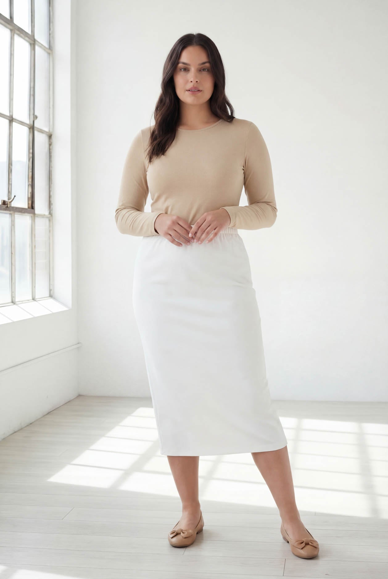 Model wearing Nuggles® 31" Classic Skirt  in White