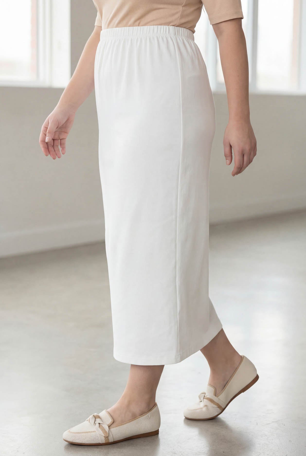 Model wearing Nuggles® 34" Classic Skirt  in White