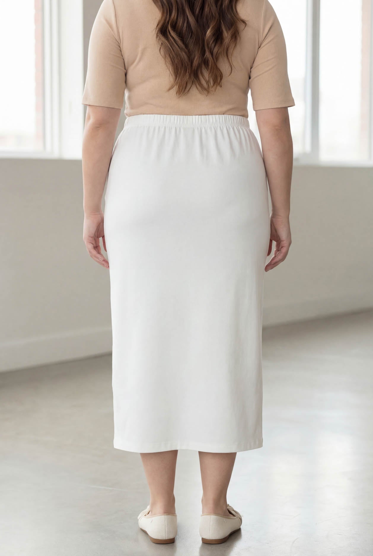 Model wearing Nuggles® 34" Classic Skirt  in White