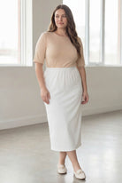 Model wearing Nuggles® 34" Classic Skirt  in White