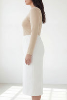 Model wearing Nuggles® 31" Classic Skirt  in White