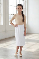 Model wearing Nuggles®  Girls Classic Skirt in White