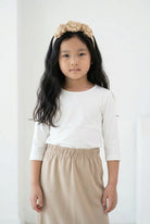 Model wearing the Girls' Nuggles® Essential 3/4 Tee in White