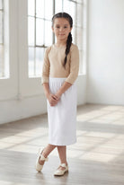 Model wearing Nuggles®  Girls Classic Skirt in White