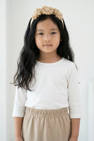 Model wearing the Girls' Nuggles® Essential 3/4 Tee in White