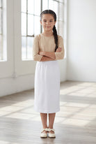 Model wearing Nuggles®  Girls Classic Skirt in White