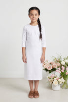 Model wearing Nuggles® Girls Midi Layering Dress in White