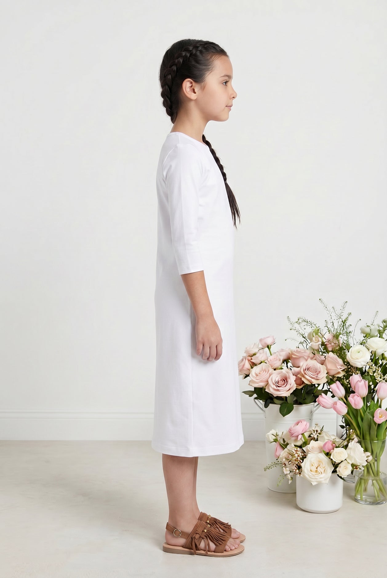 Model wearing Nuggles® Girls Midi Layering Dress in White