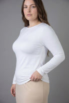 Model wearing Nuggles® Long Sleeve Essential Tee in White