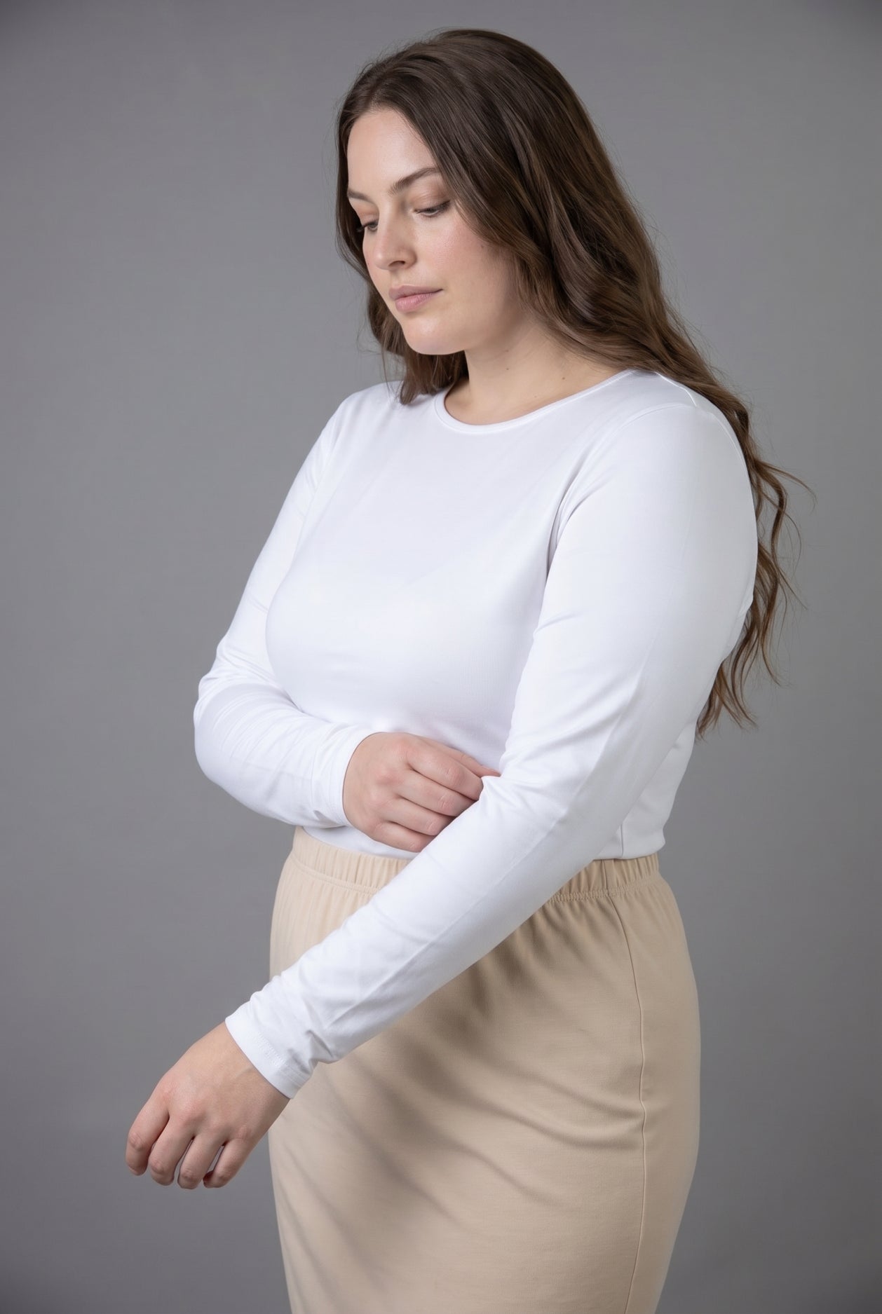 Model wearing Nuggles® Long Sleeve Essential Tee in White