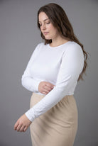 Model wearing Nuggles® Long Sleeve Essential Tee in White