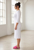Model wearing Nuggles® Midi Layering Dress in White