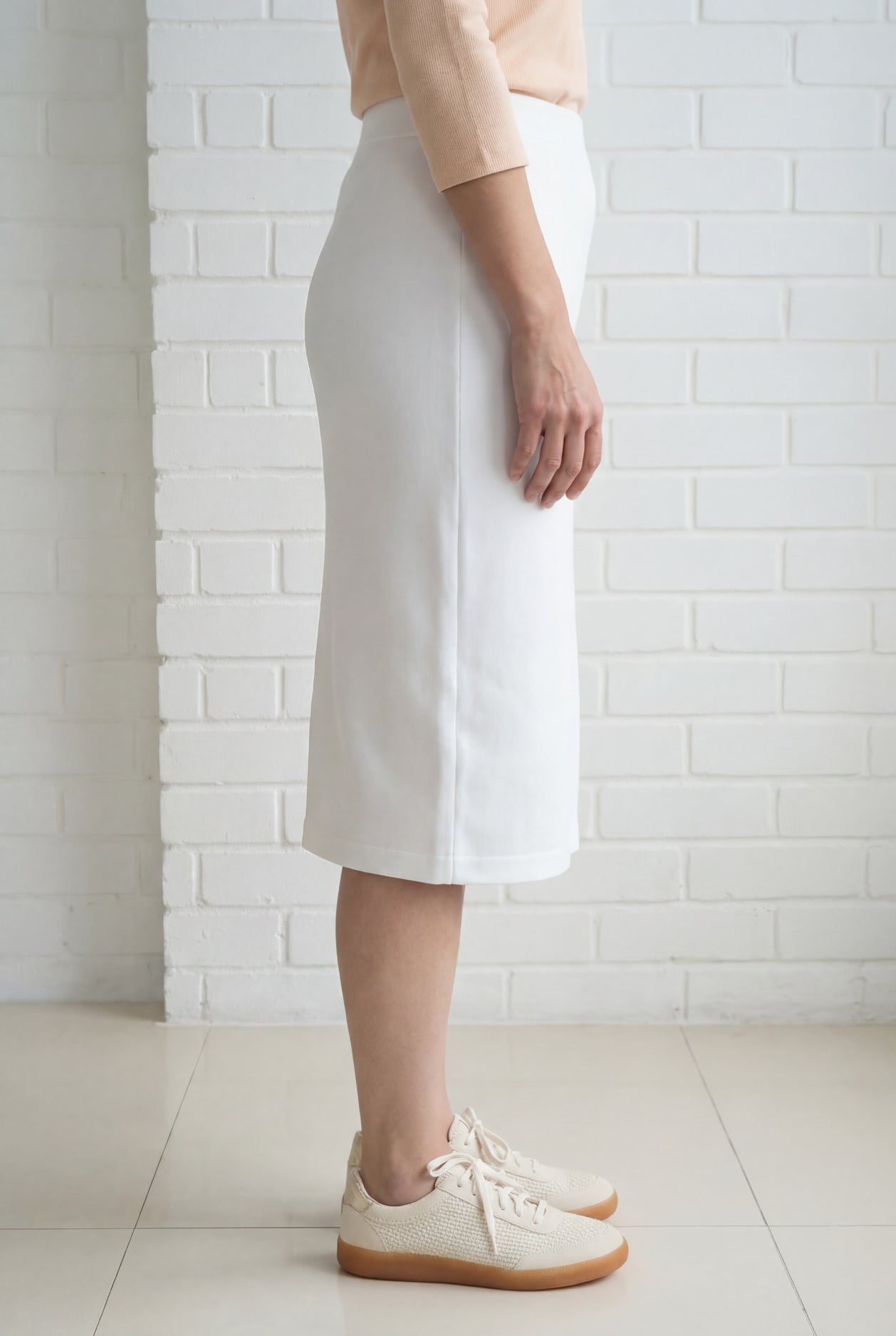Model wearing Nuggles® 27" Relaxed Skirt in White