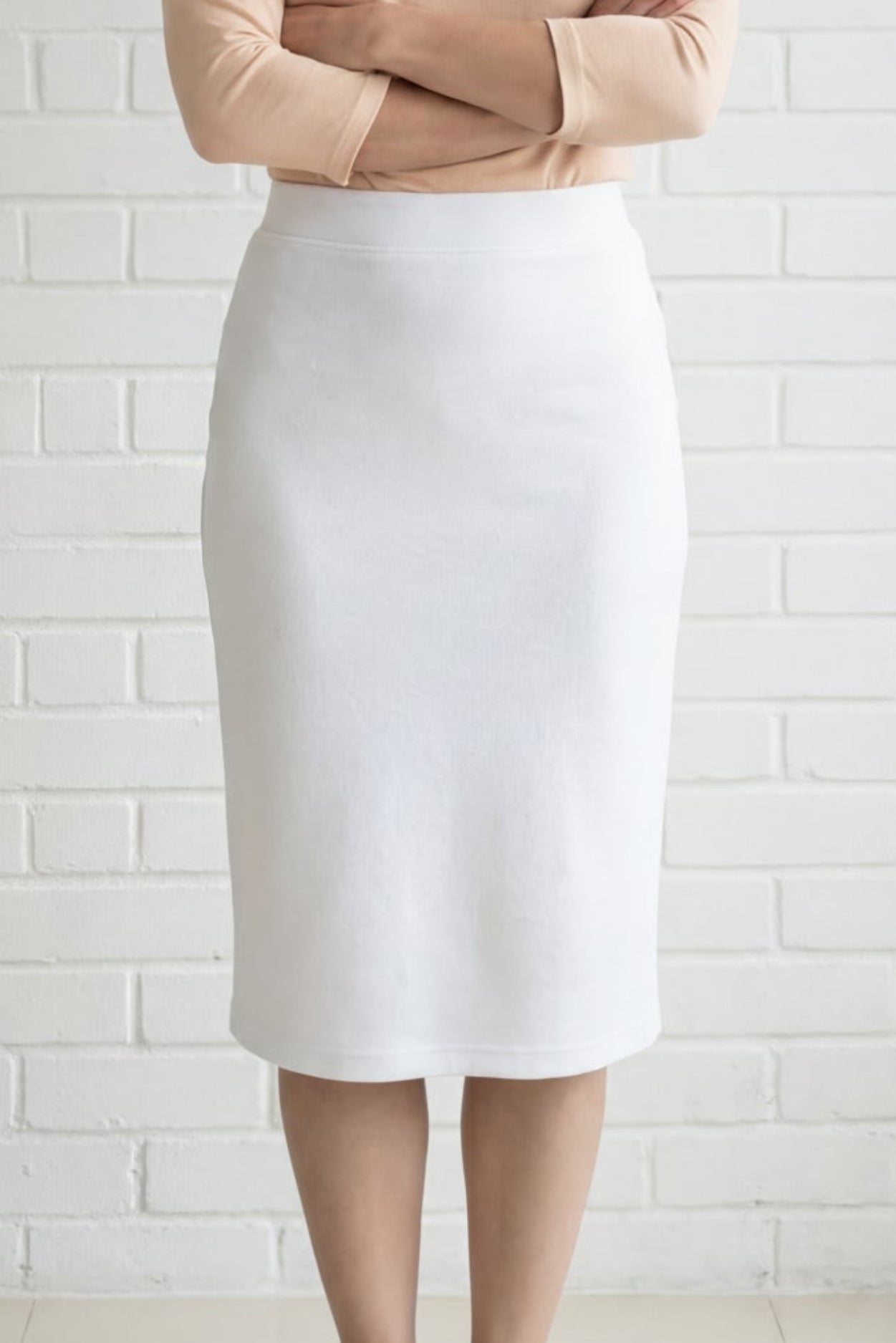 Model wearing Nuggles® 27" Relaxed Skirt in White