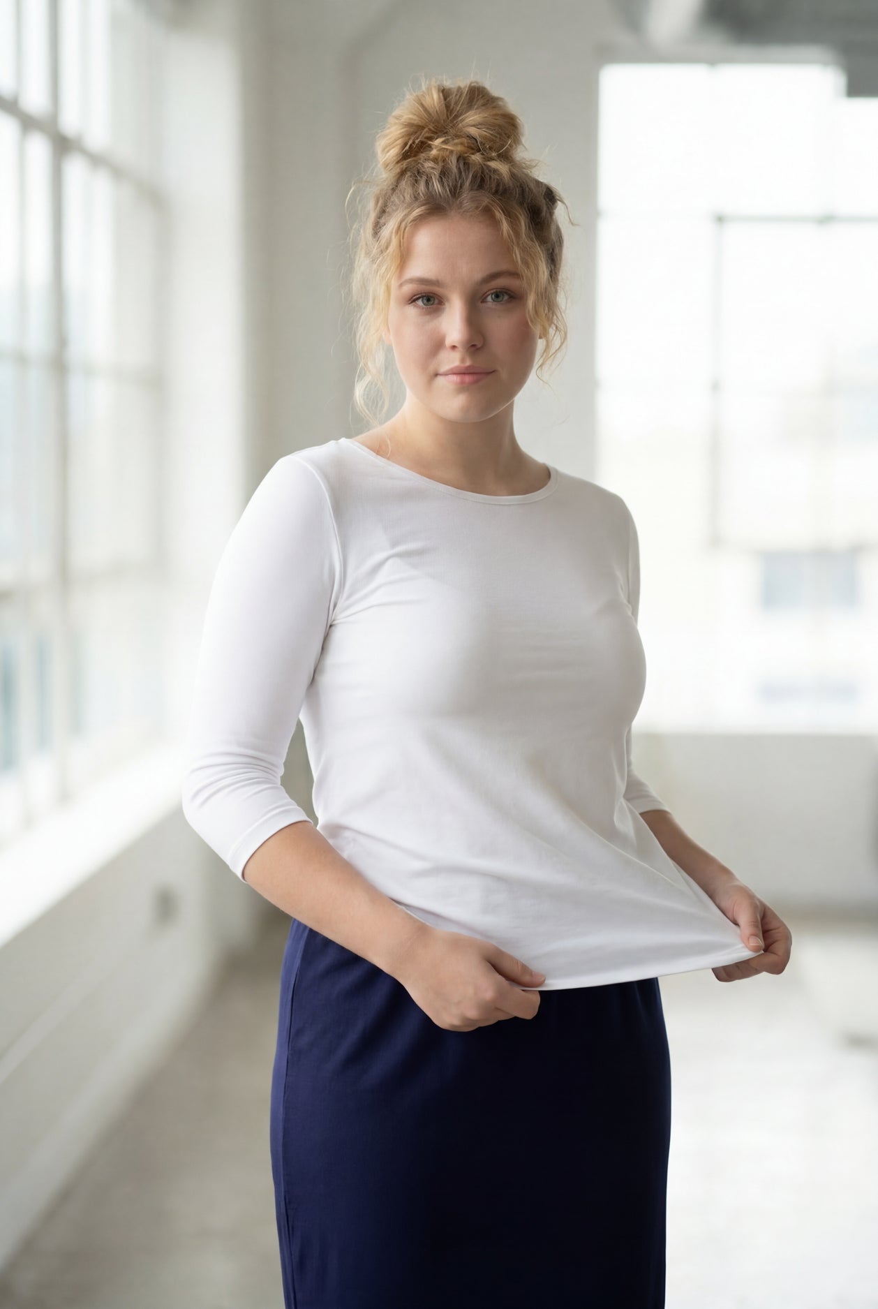 Model wearing the Nuggles® Essential 3/4 Tee in White
