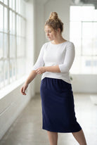 Model wearing the Nuggles® Essential 3/4 Tee in White