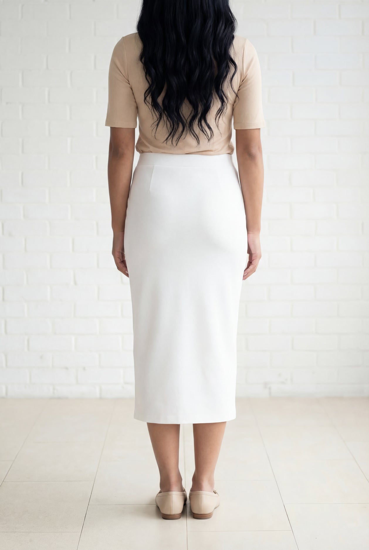 Model wearing Nuggles® 31" Relaxed Skirt in White