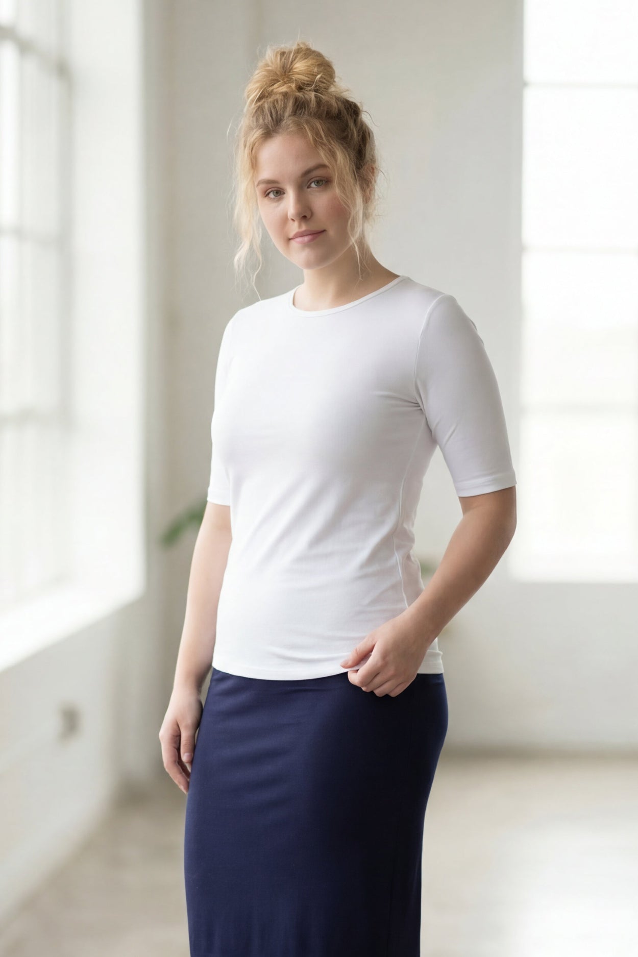 Model wearing the Nuggles® Essential Half Sleeve Tee in White
