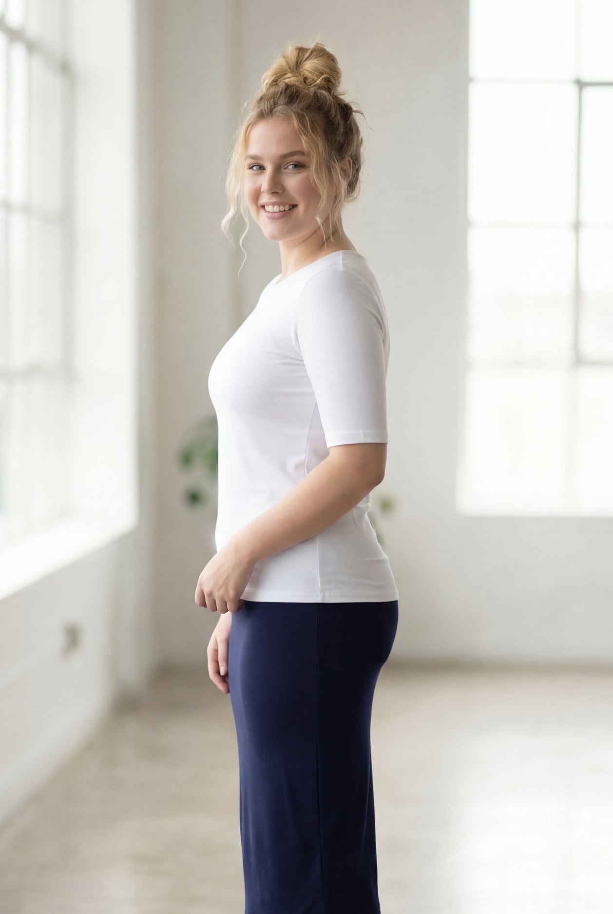 Model wearing the Nuggles® Essential Half Sleeve Tee in White