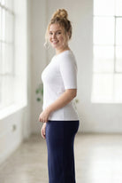Model wearing the Nuggles® Essential Half Sleeve Tee in White