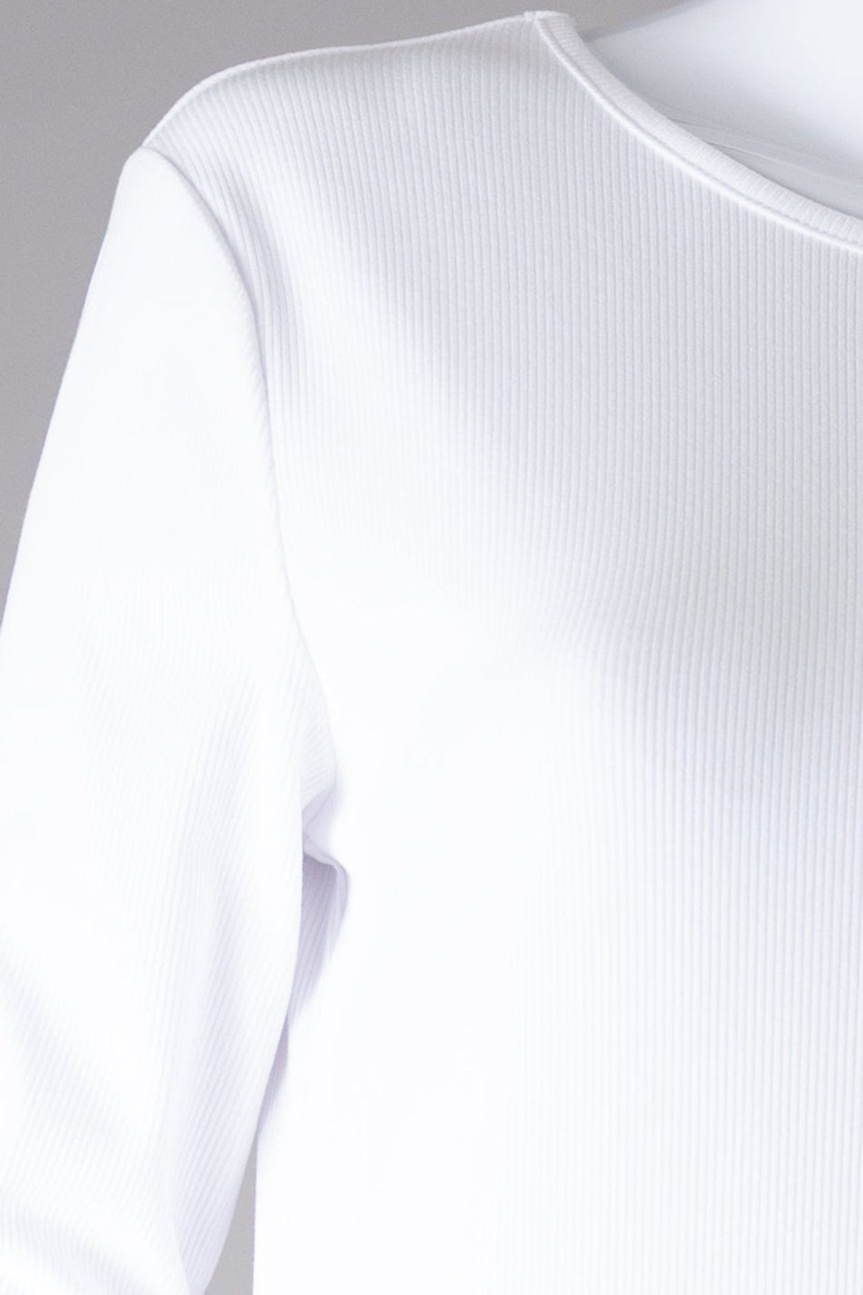 Model wearing Nuggles® Ribbed Layering Dress in White