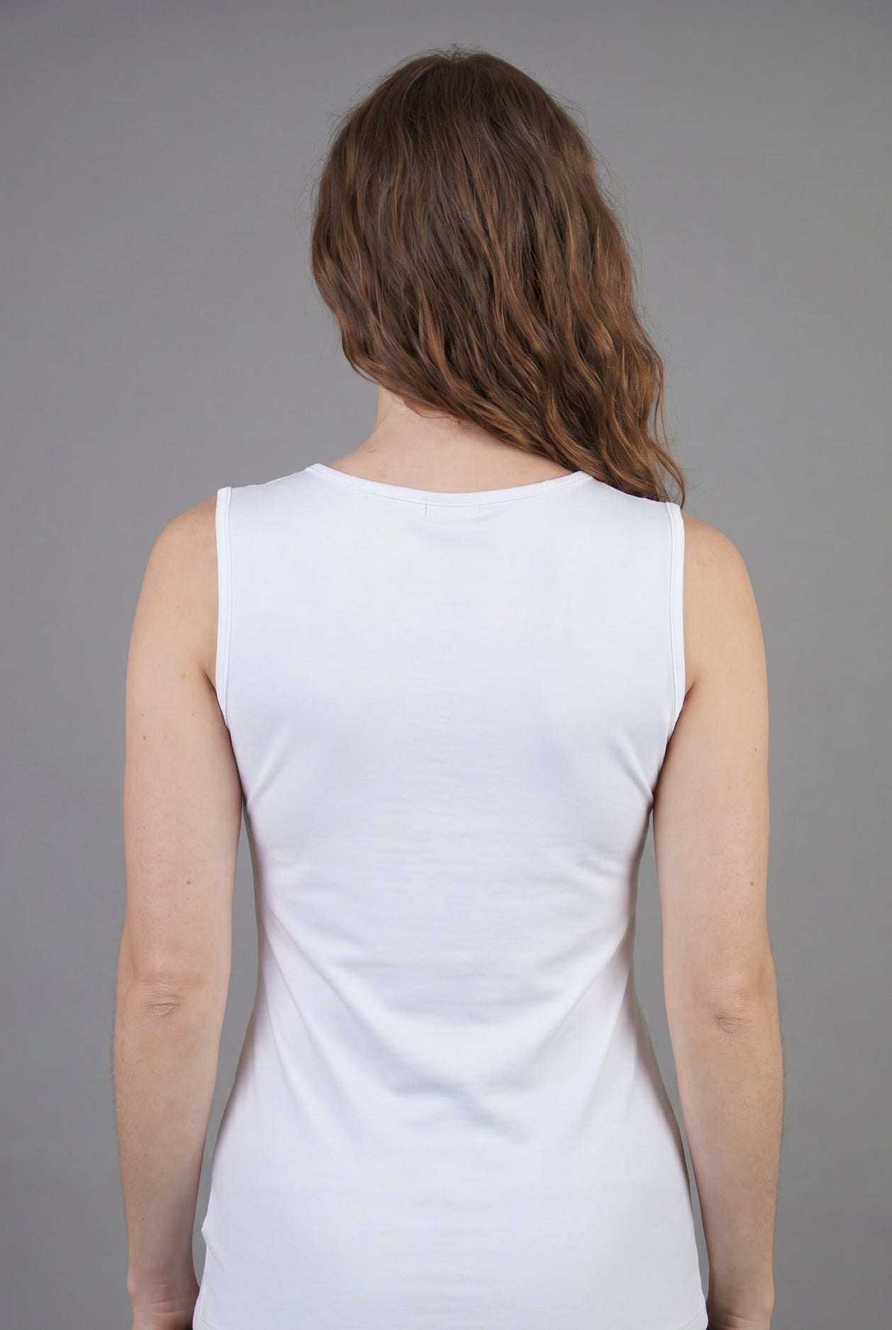 Model wearing Nuggles® Essential Tank in White