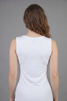 Model wearing Nuggles® Essential Tank in White