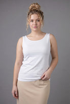 Model wearing Nuggles® Wide Neck Tank in White