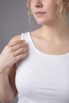 Model wearing Nuggles® Wide Neck Tank in White