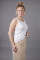 Model wearing Nuggles® Wide Neck Tank in White