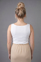 Model wearing Nuggles® Wide Neck Tank in White