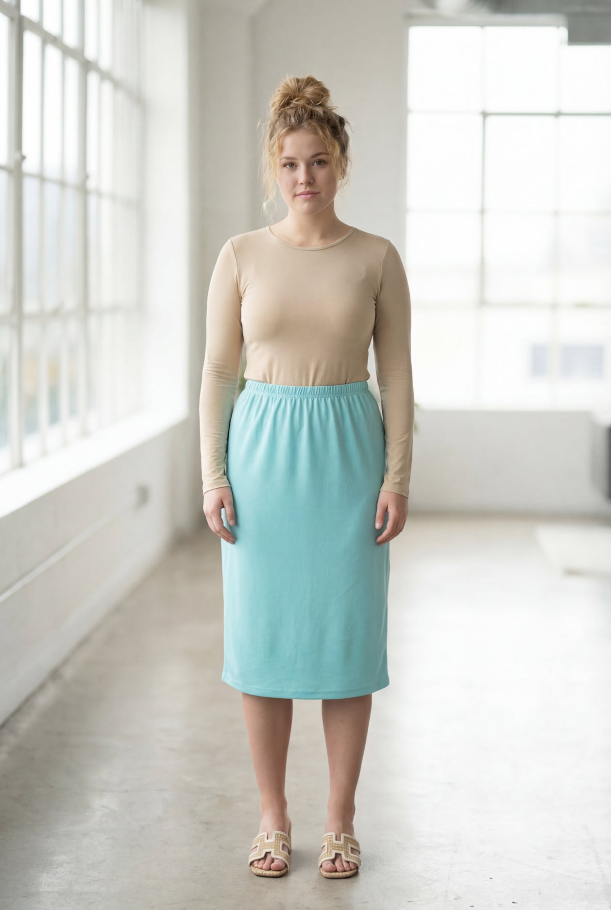 Model wearing Nuggles® 27" Classic Skirt in Aqua