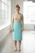 Model wearing Nuggles® 27" Classic Skirt in Aqua
